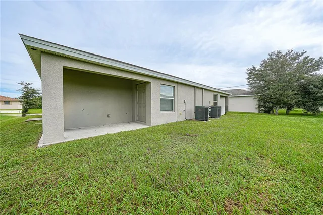 a house view with a backyard space