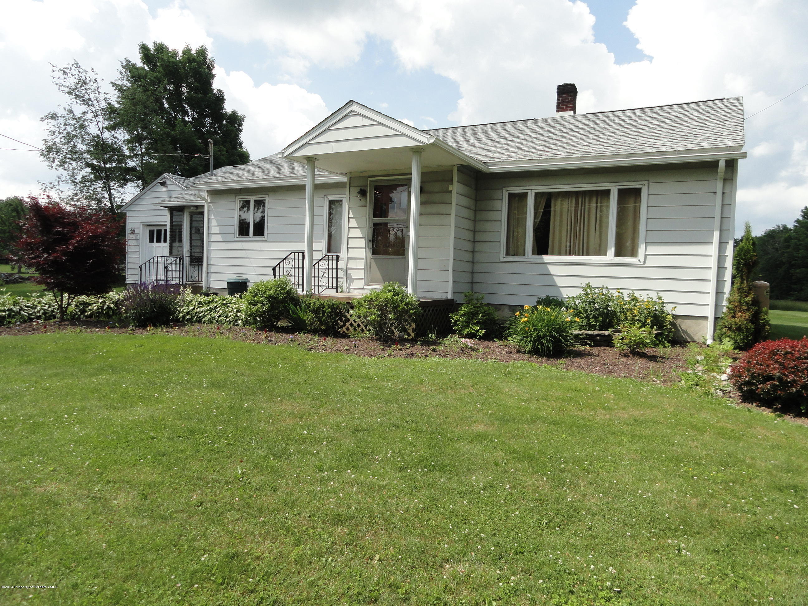 2310 Quicktown Road Moscow, PA 18444 - Photo 42 of 52 a front view of a house with garden