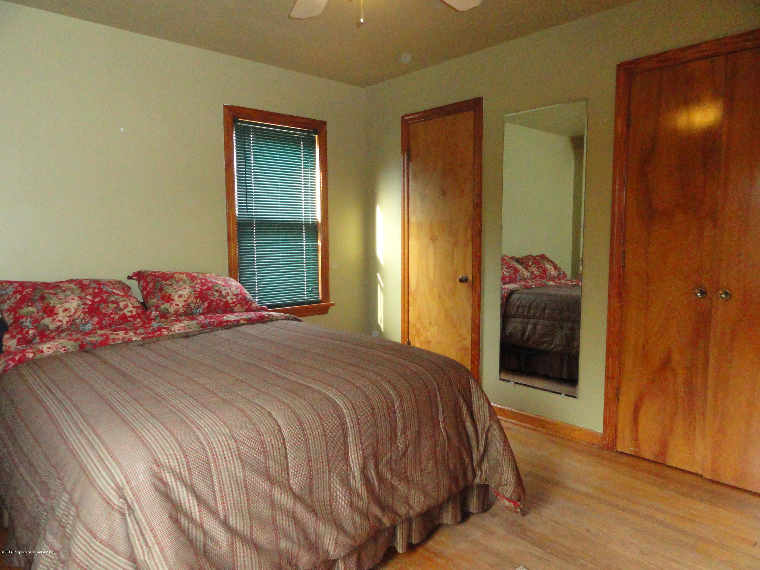 2310 Quicktown Road Moscow, PA 18444 - Photo 8 of 52 a bedroom with a bed and a mirror