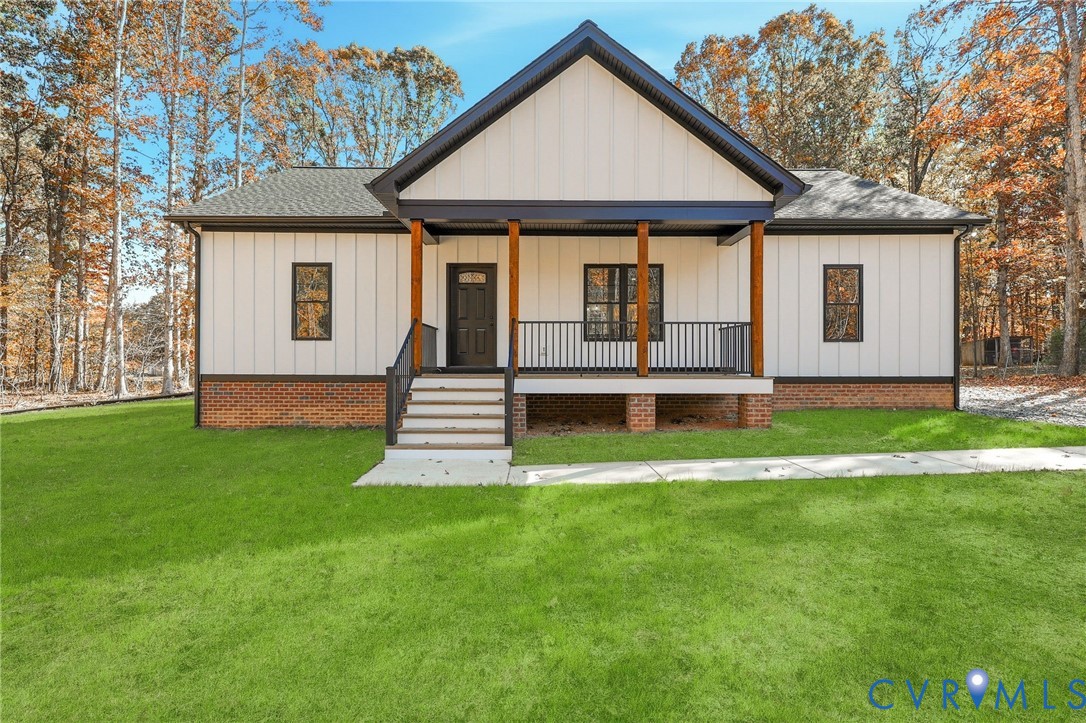 2255 Bagby Road Bumpass, VA 23024 - Photo 1 of 30 a front view of a house with a yard