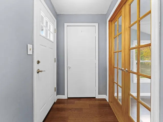 a view of front door with wooden floor