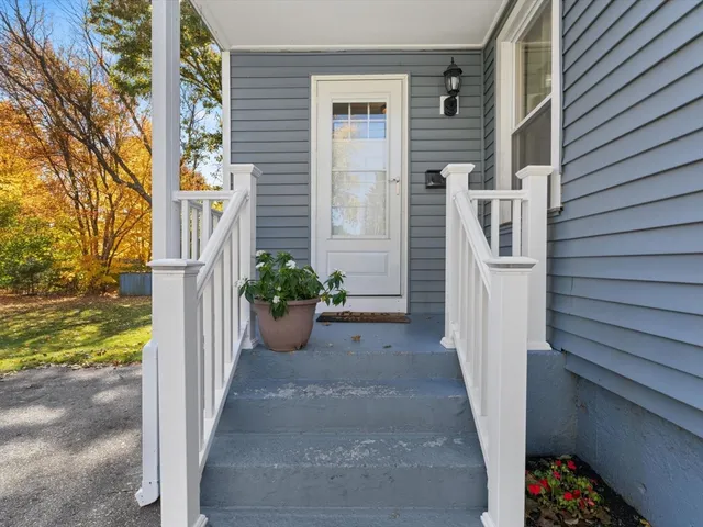 a view of a door and chair in the balcony