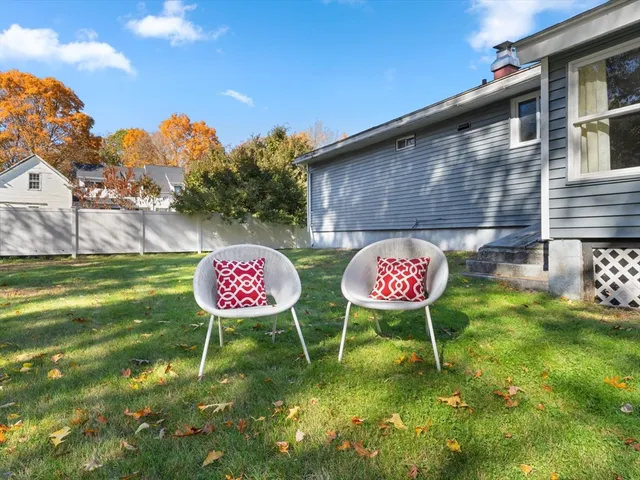 a view of yard with large trees