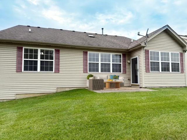 a front view of a house with a garden and porch