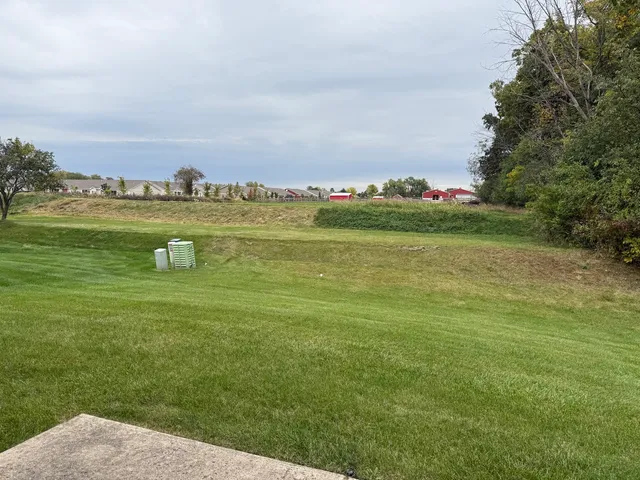 a view of a lake with houses in the back