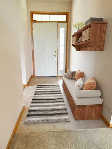 a bedroom with a bed and painting on the wall
