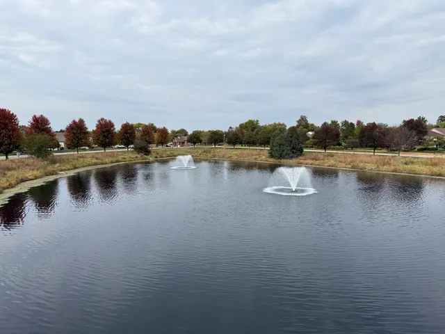 a view of a lake with houses in the back