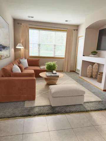 a living room with furniture and a window