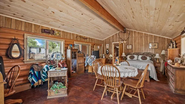 a dining area with furniture water view and outdoor seating