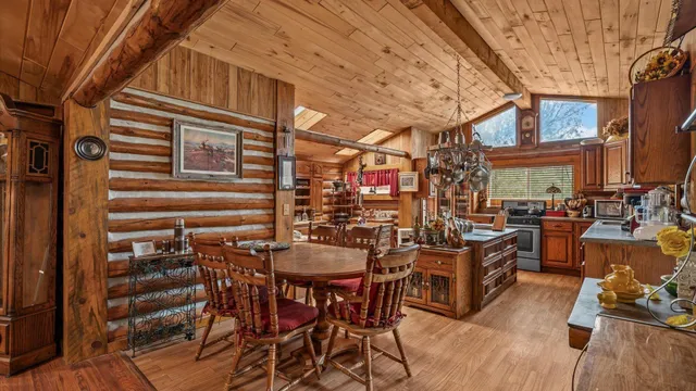 a view of a chairs and table in a patio