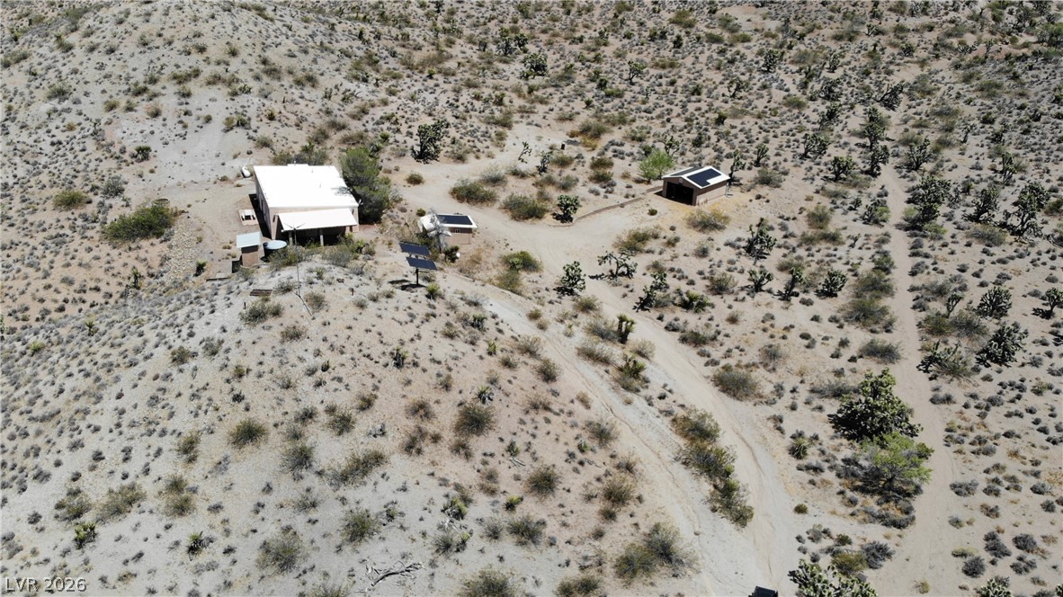 Rocking S Ranch Road Searchlight, NV 89046 - Photo 5 of 47 Perched on a vast desert expanse, this property offers serene isolation and sustainable living.