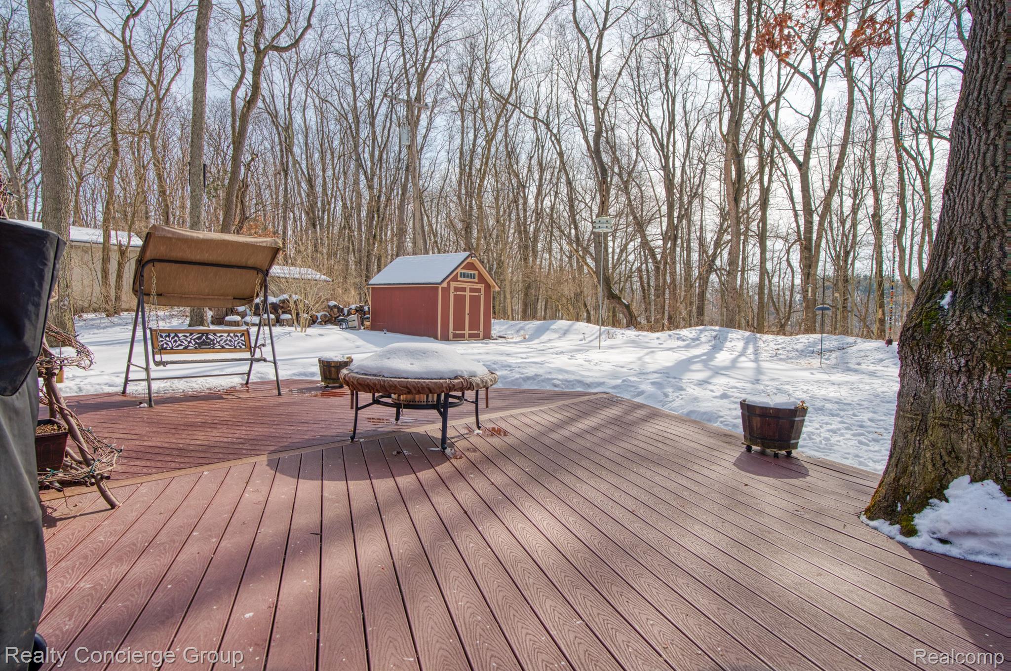 7170 Cowell Road Brighton, MI 48116 - Photo 30 of 38 Deck is surrounded w/ views of nature