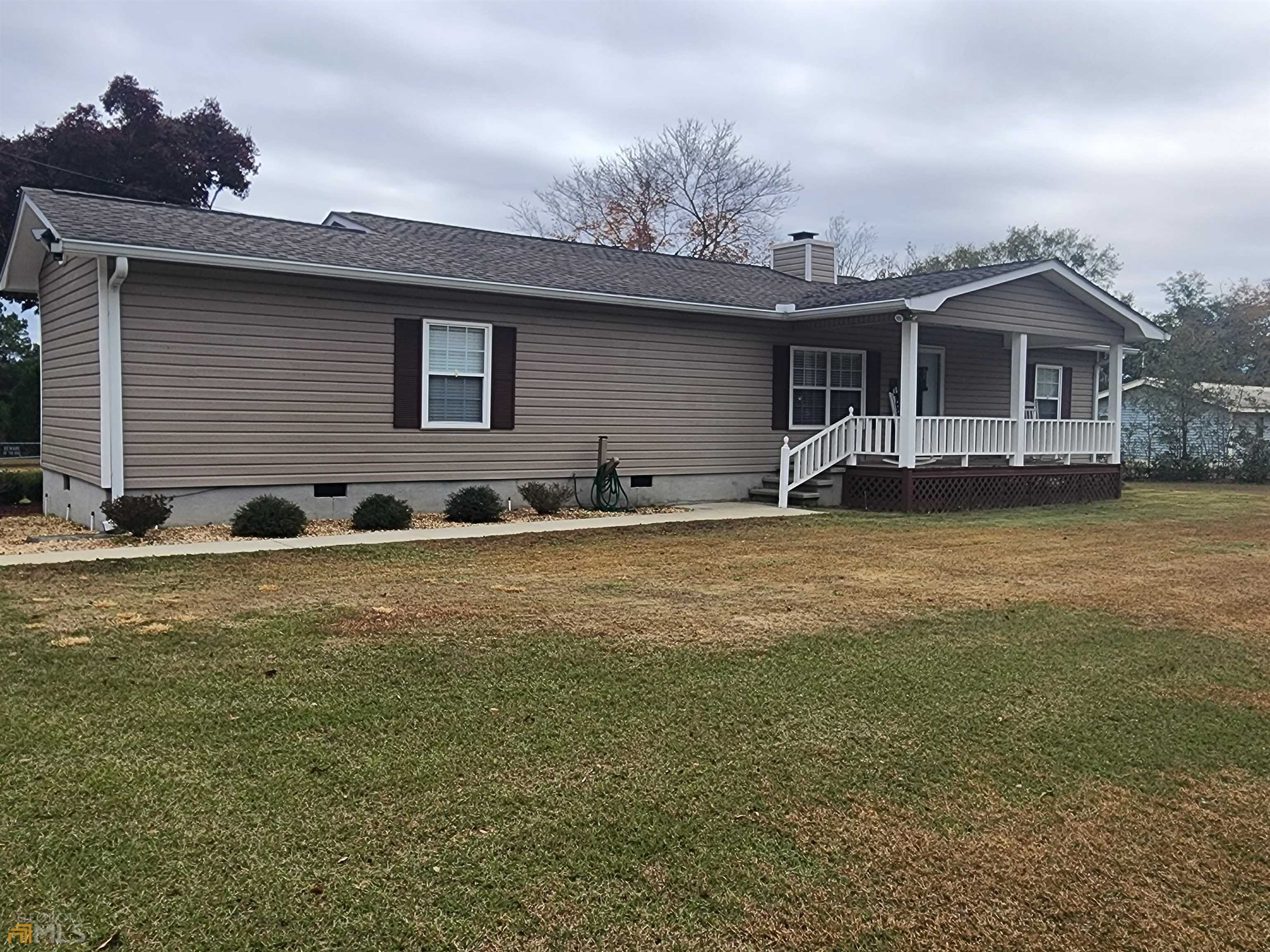 159 Ernest Stinson Road, Unit ERNEST East Dublin, GA 31027 - Photo 1 of 1 a front view of a house with a yard