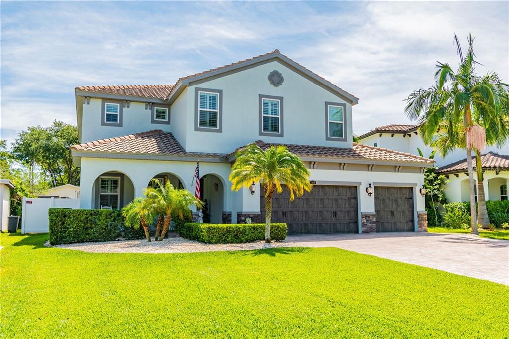 Welcome home to your Mediterranean inspired newer construction home with huge lot, long life barrel tile roof, 3 car garage and lush, tropical landscaping!