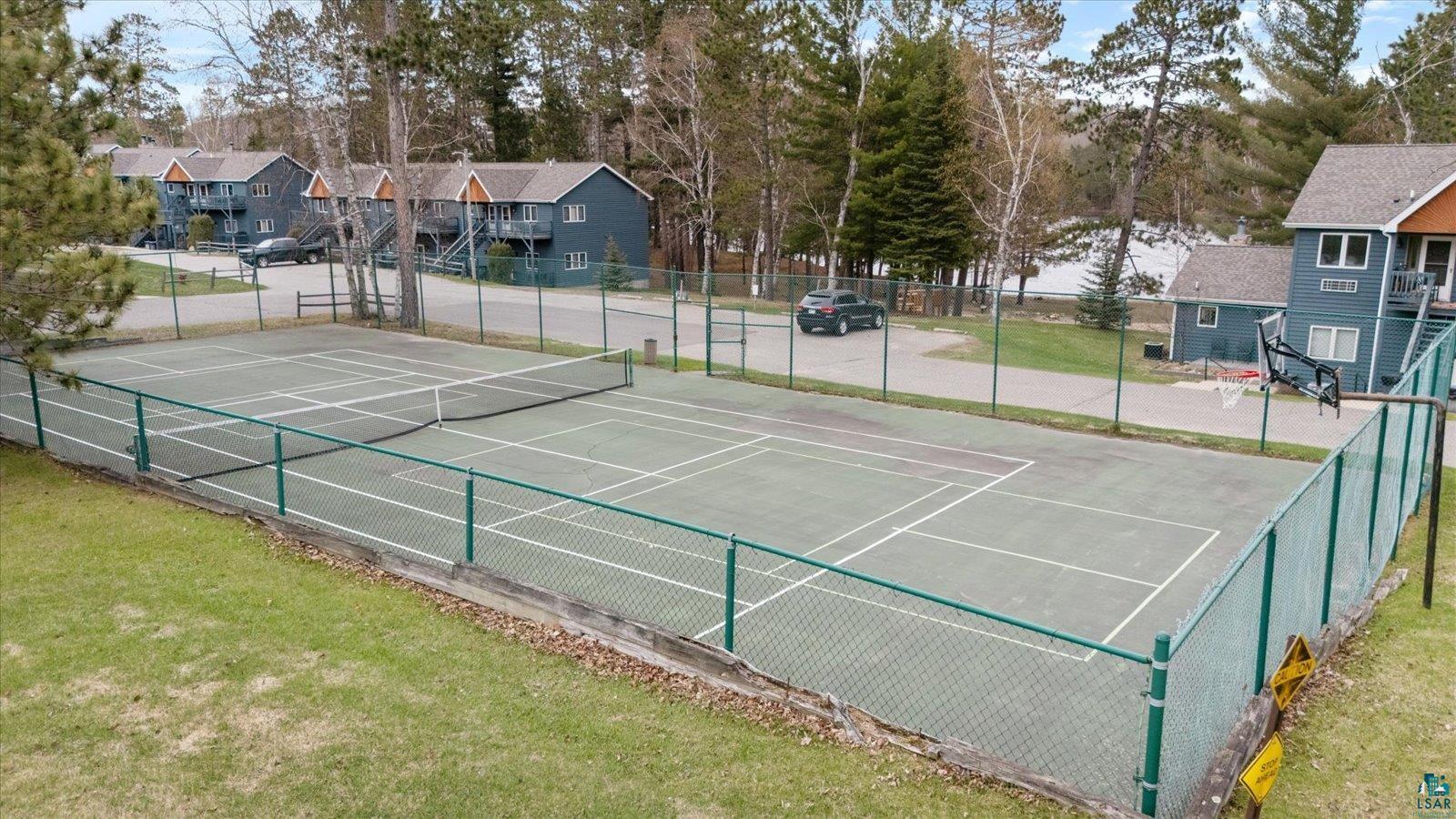 6266 Giants Ridge Road Biwabik, MN 55705 - Photo 36 of 37 Hard surface tennis court with green chain-link fencing