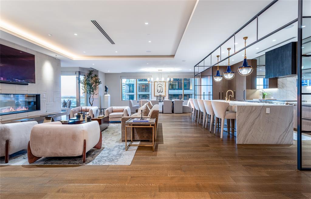 2300 Wolf Street, Unit 7D Dallas, TX 75201 - Photo 1 of 40 a living room with furniture and a flat screen tv