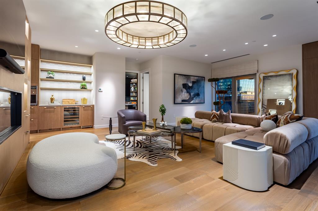 2300 Wolf Street, Unit 7D Dallas, TX 75201 - Photo 13 of 40 a living room with fireplace furniture and a large window