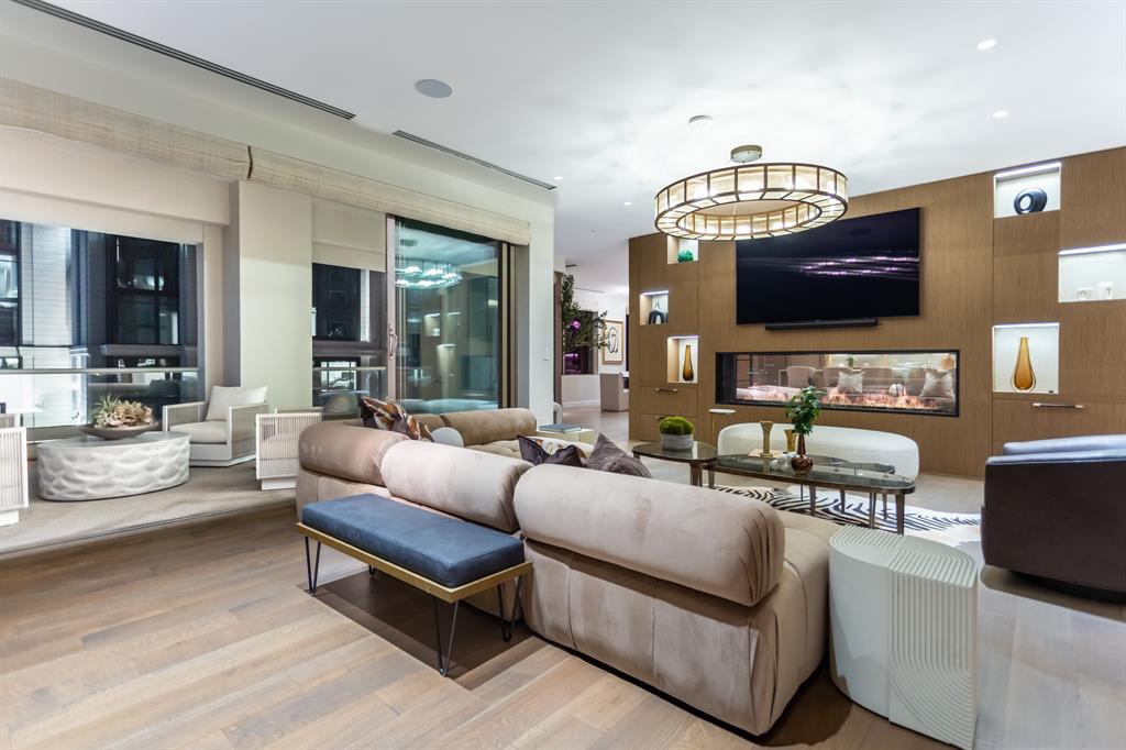 2300 Wolf Street, Unit 7D Dallas, TX 75201 - Photo 14 of 40 a living room with furniture and a flat screen tv