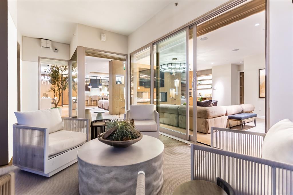 2300 Wolf Street, Unit 7D Dallas, TX 75201 - Photo 16 of 40 a living room with furniture and a floor to ceiling window