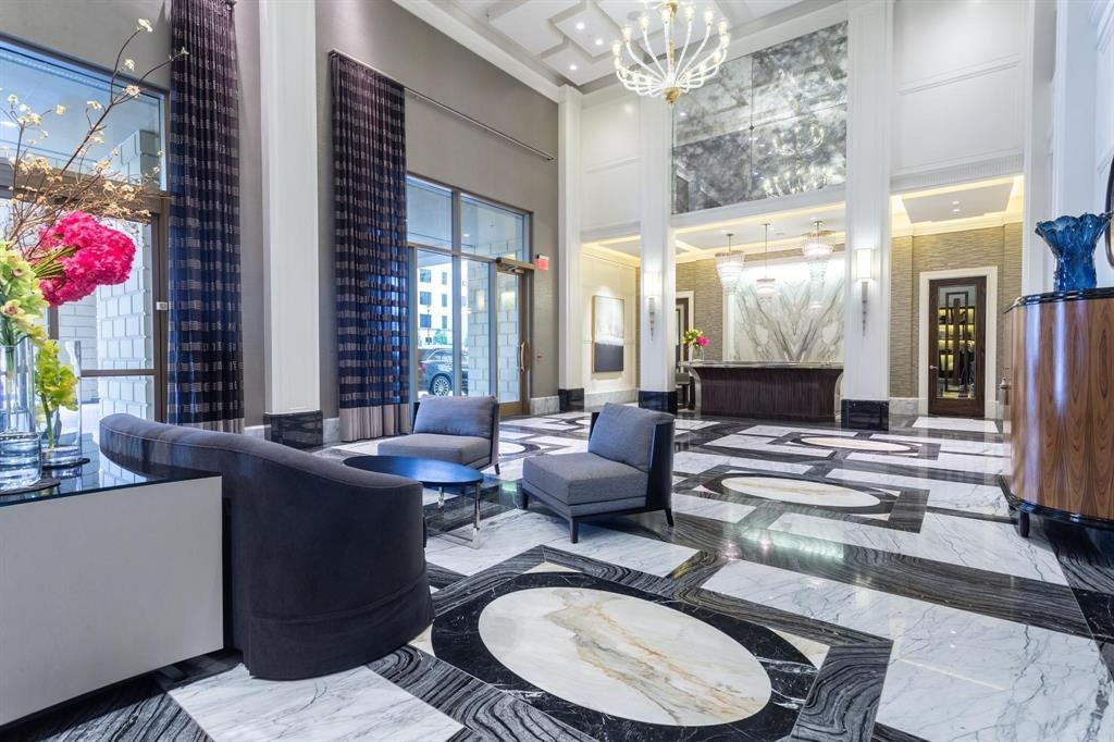 2300 Wolf Street, Unit 7D Dallas, TX 75201 - Photo 32 of 40 a living room with furniture and a chandelier