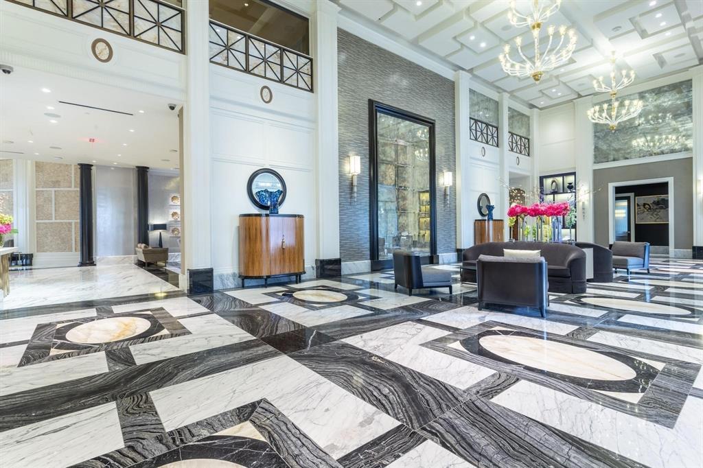 2300 Wolf Street, Unit 7D Dallas, TX 75201 - Photo 33 of 40 a living room with furniture and a chandelier