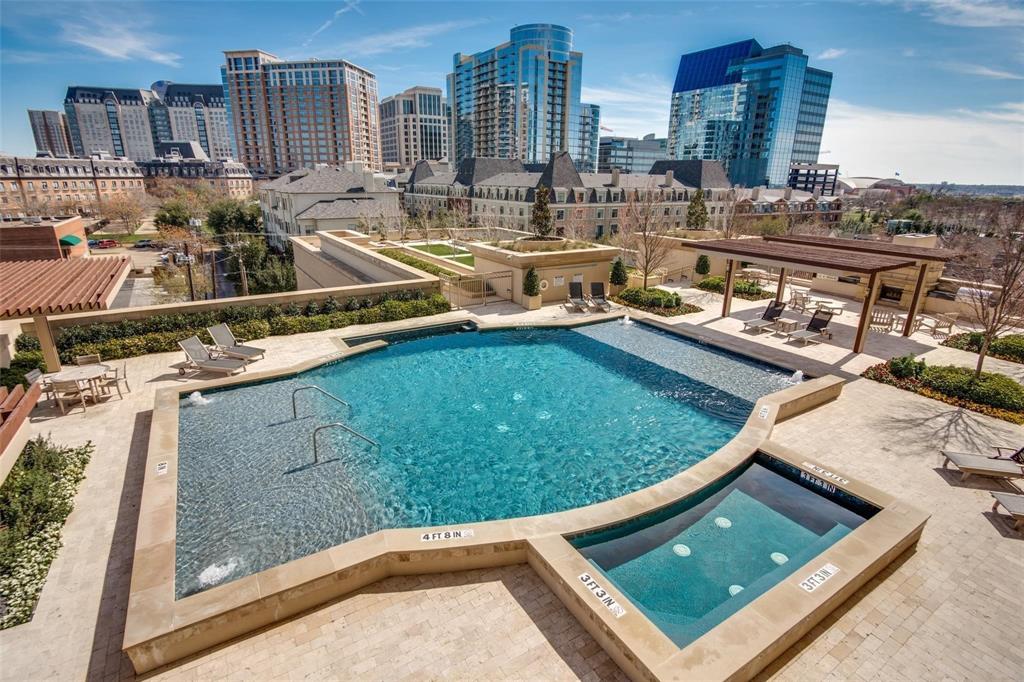 2300 Wolf Street, Unit 7D Dallas, TX 75201 - Photo 34 of 40 a view of a swimming pool with outdoor seating and city view
