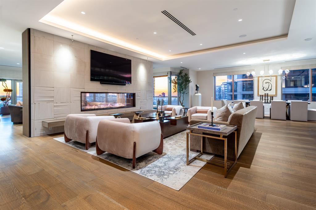 2300 Wolf Street, Unit 7D Dallas, TX 75201 - Photo 4 of 40 a living room with furniture and a flat screen tv