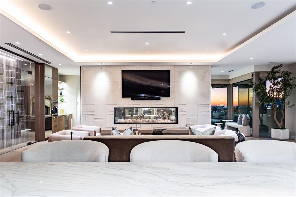 2300 Wolf Street, Unit 7D Dallas, TX 75201 - Photo 6 of 40 a living room with furniture and a flat screen tv