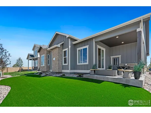 a terrace of a house with outdoor seating