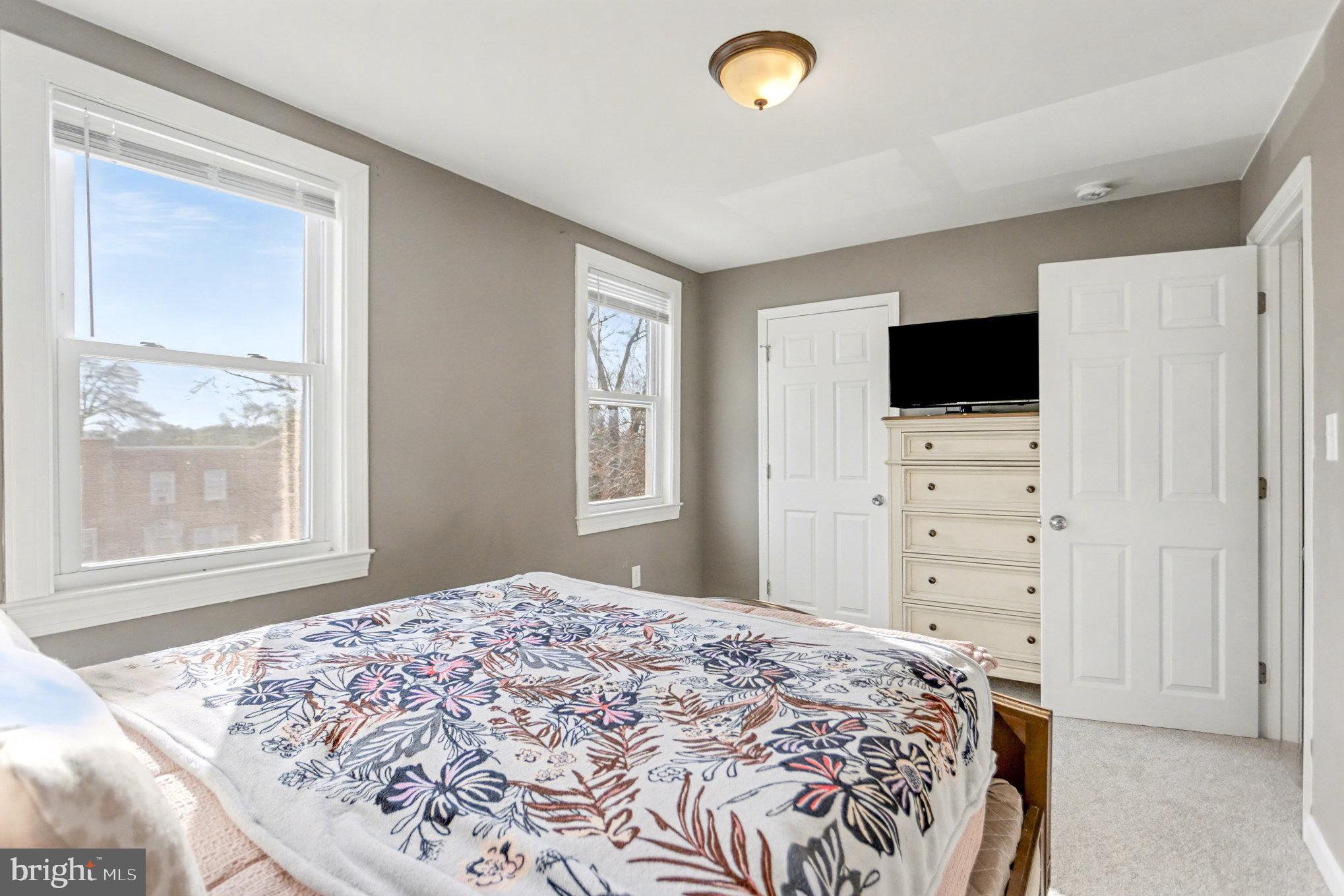 8656 Oak Road Baltimore, MD 21234 - Photo 10 of 30 a bedroom with a bed and a flat screen tv