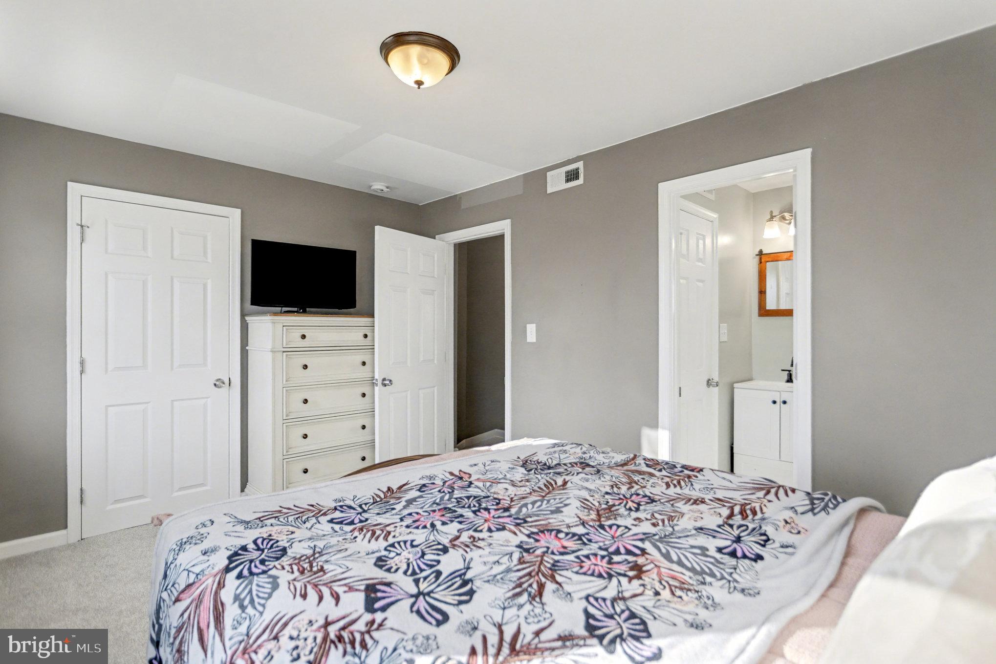 8656 Oak Road Baltimore, MD 21234 - Photo 11 of 30 a bedroom with a bed and a flat screen tv