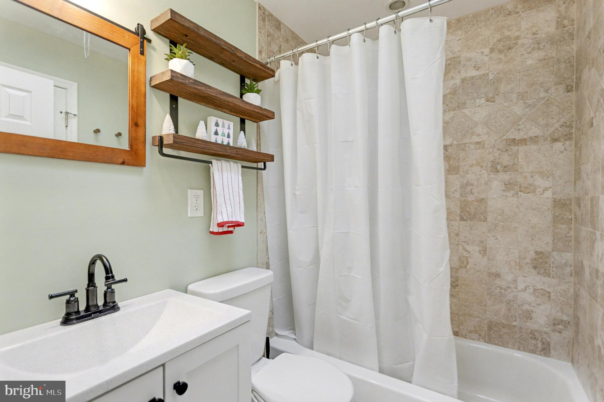 8656 Oak Road Baltimore, MD 21234 - Photo 12 of 30 a bathroom with a sink and a mirror