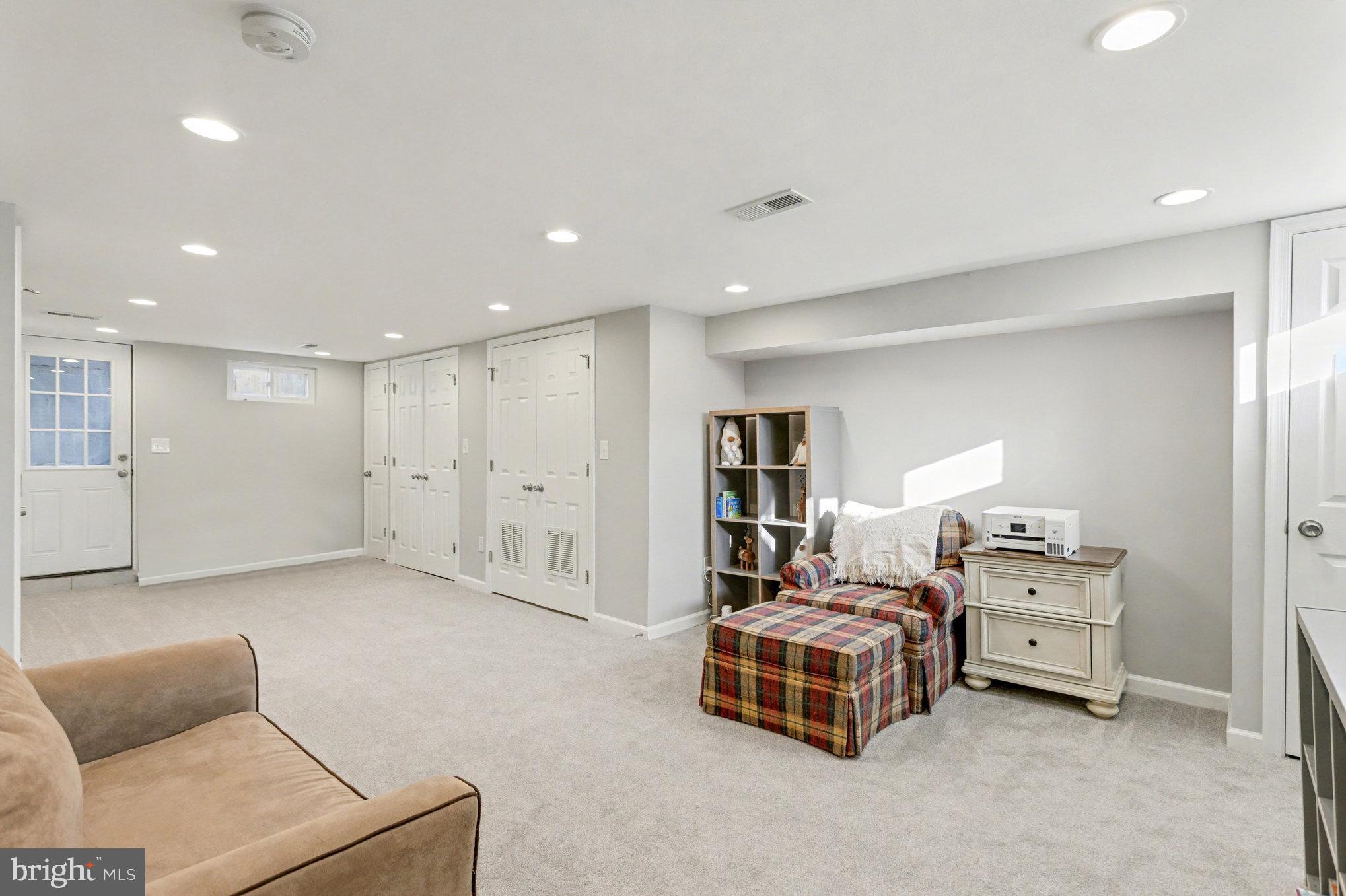 8656 Oak Road Baltimore, MD 21234 - Photo 19 of 30 a spacious bedroom with a bed and a couch