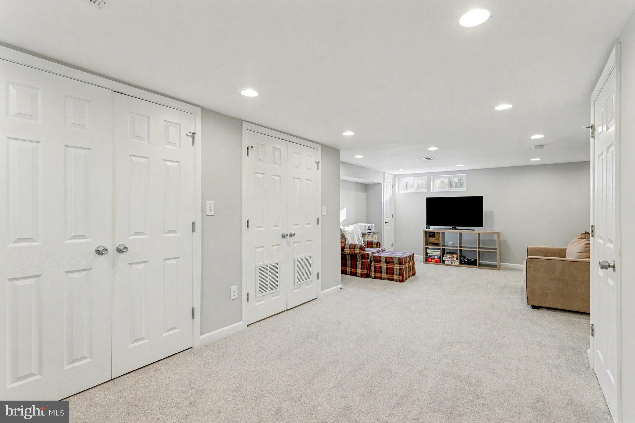 8656 Oak Road Baltimore, MD 21234 - Photo 20 of 30 a living room with furniture and a flat screen tv