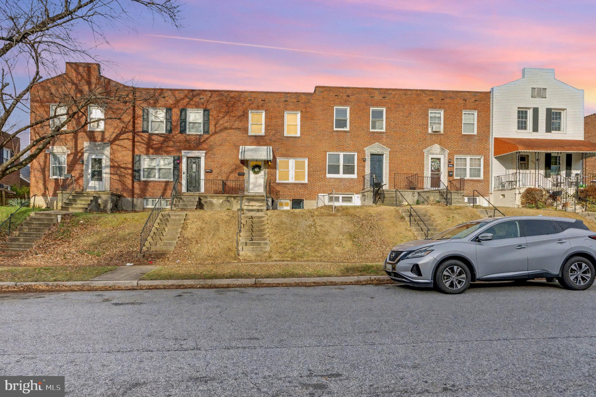 8656 Oak Road Baltimore, MD 21234 - Photo 26 of 30 a front view of a residential apartment building with a yard
