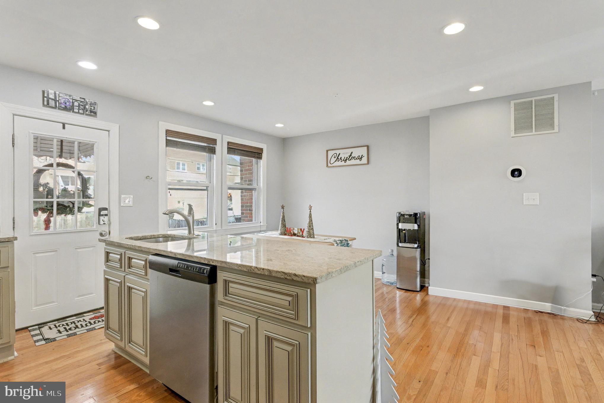 8656 Oak Road Baltimore, MD 21234 - Photo 8 of 30 a kitchen with a sink stove and cabinets