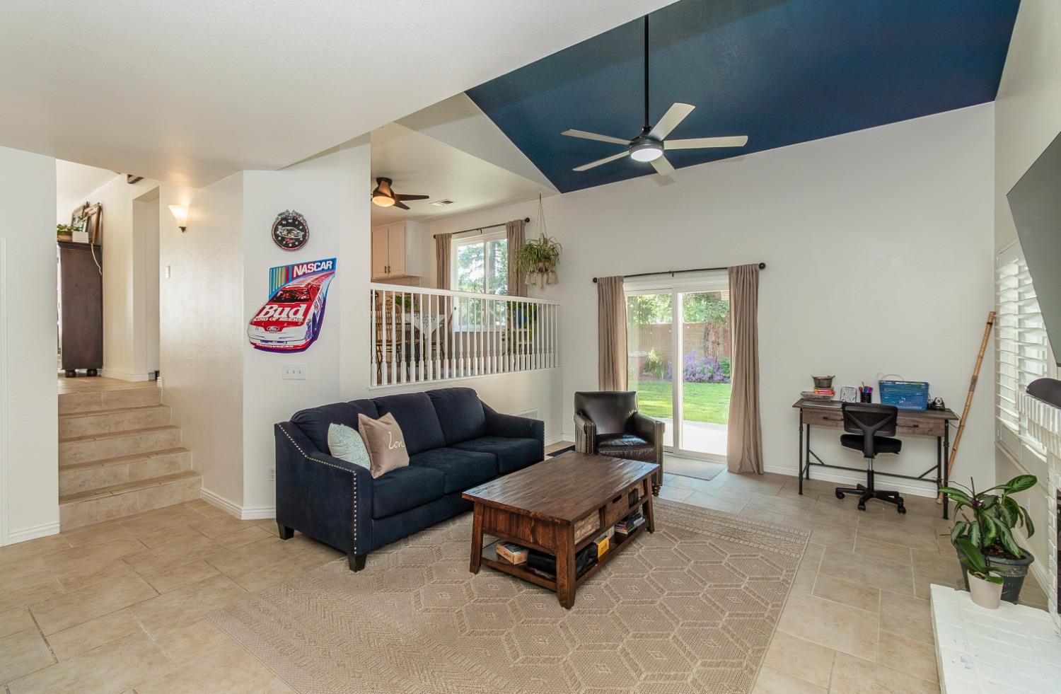 1323 Oak Avenue Clovis, CA 93611 - Photo 14 of 42 a living room with furniture and a flat screen tv
