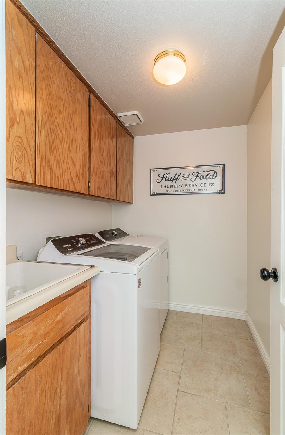 1323 Oak Avenue Clovis, CA 93611 - Photo 16 of 42 a view of a storage & utility room with washer and dryer
