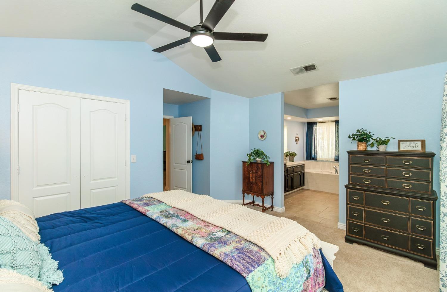 1323 Oak Avenue Clovis, CA 93611 - Photo 20 of 42 a bedroom with a bed and a dresser