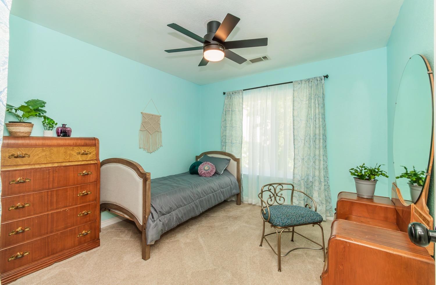 1323 Oak Avenue Clovis, CA 93611 - Photo 23 of 42 a living room with furniture and a potted plant