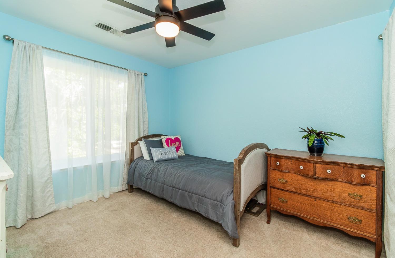 1323 Oak Avenue Clovis, CA 93611 - Photo 25 of 42 a living room with furniture and a window