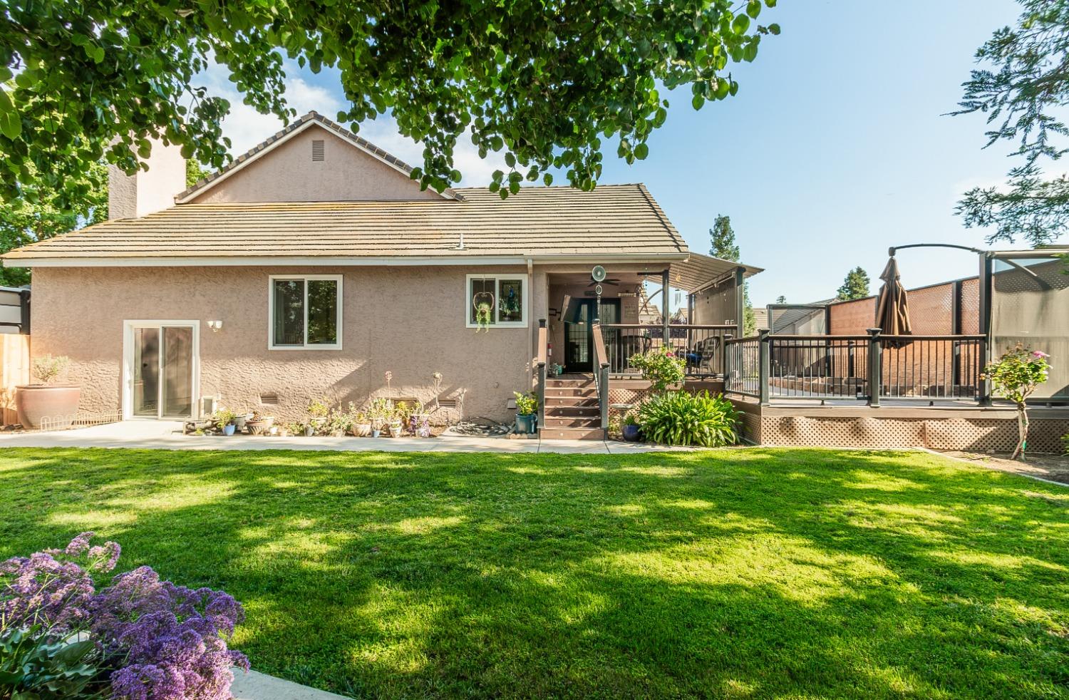 1323 Oak Avenue Clovis, CA 93611 - Photo 30 of 42 a front view of house with yard outdoor seating and green space