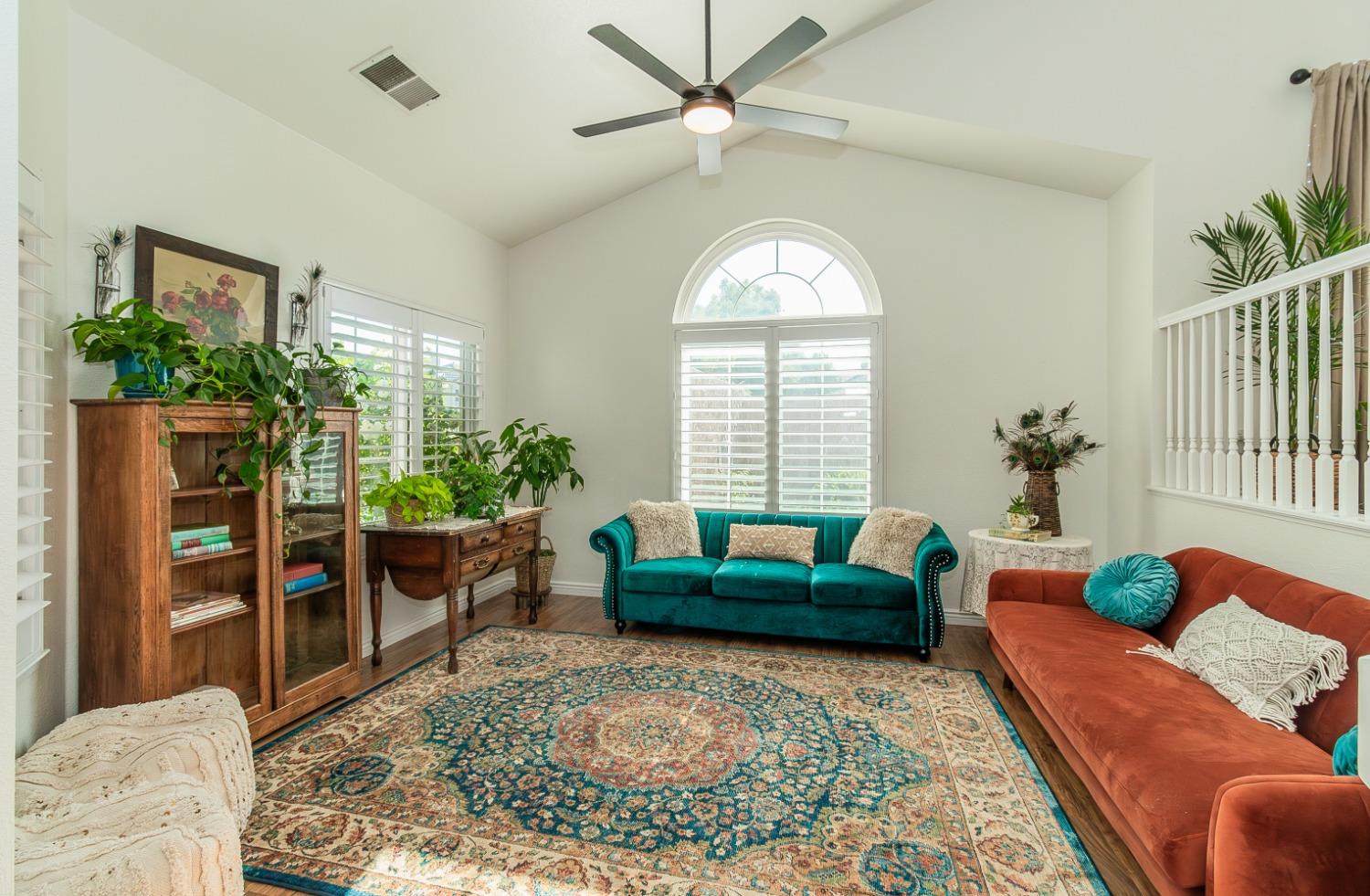 1323 Oak Avenue Clovis, CA 93611 - Photo 3 of 42 a living room with furniture and a potted plant
