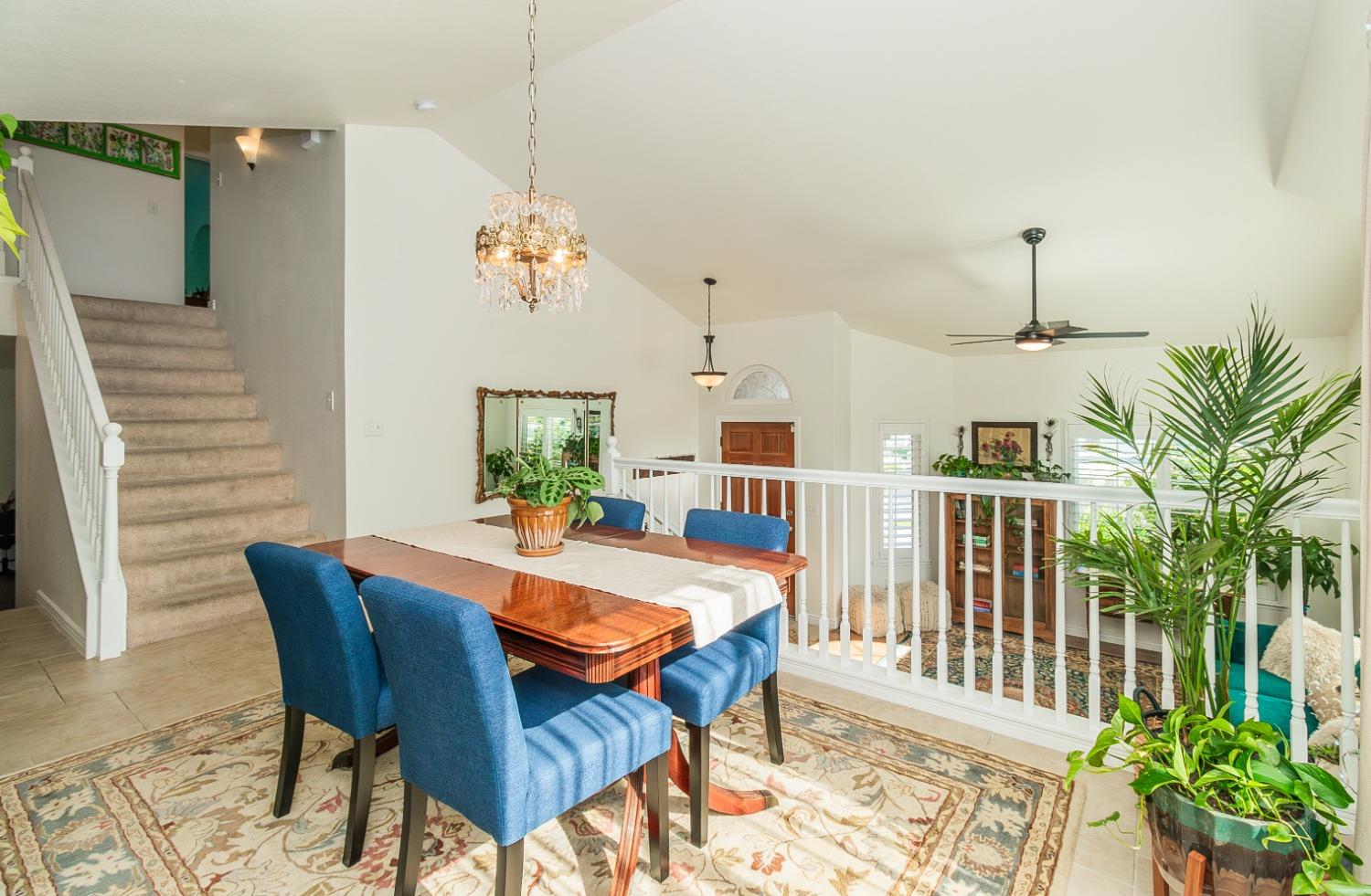1323 Oak Avenue Clovis, CA 93611 - Photo 8 of 42 a dining room with furniture potted plants and wooden floor
