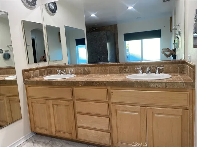 a bathroom with a bathtub and shower