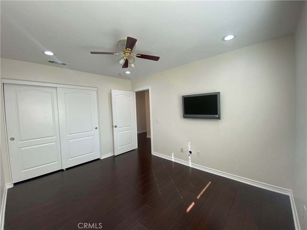 19303 Cohasset Street Reseda, CA 91335 - Photo 22 of 30 a view of a livingroom with an empty space & wooden floor