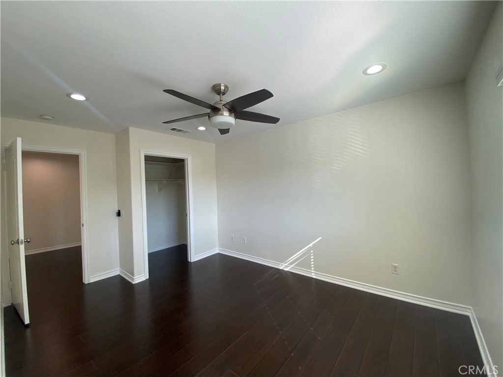 19303 Cohasset Street Reseda, CA 91335 - Photo 24 of 30 an empty room with wooden floor and a ceiling fan