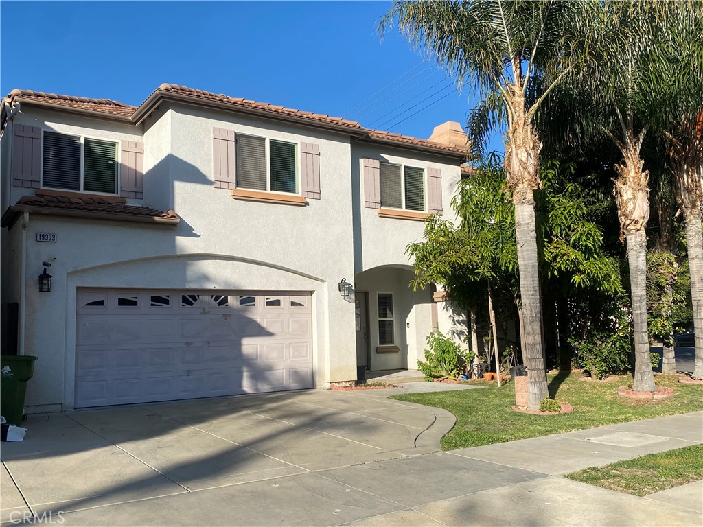 19303 Cohasset Street Reseda, CA 91335 - Photo 30 of 30 a front view of a house with a yard and garage