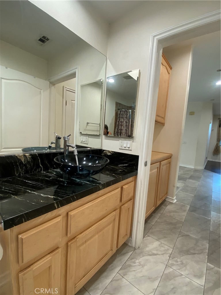 19303 Cohasset Street Reseda, CA 91335 - Photo 10 of 30 a close view of a sink and a mirror in a room