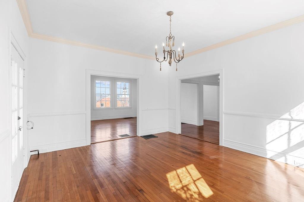 312 East 3rd Street Rome, GA 30161 - Photo 9 of 42 a view of empty room with wooden floor and window